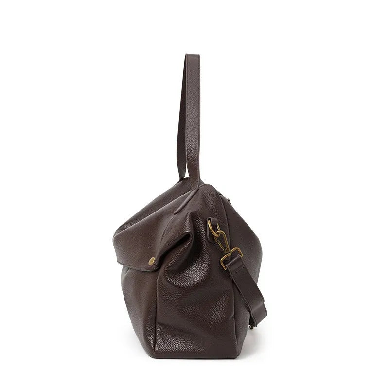 Brown genuine leather women's commuter shoulder bag showing horizontal square design and shoulder strap