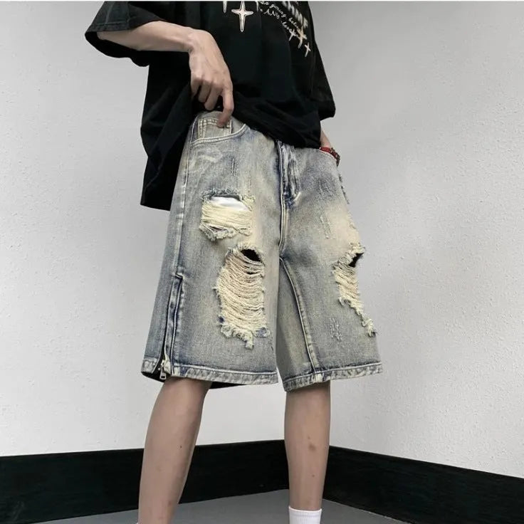 Blue retro denim shorts with a wide-leg loose fit and tattered distressing on the legs.