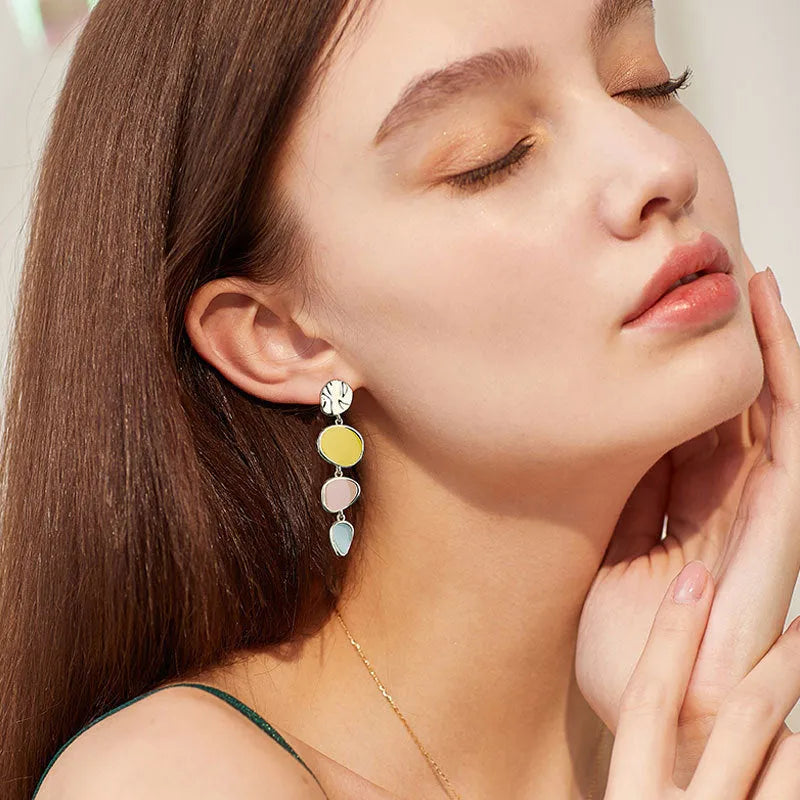 Morandi three-colour oil drip finish on a pair of simple alloy disc earrings with sterling silver posts.