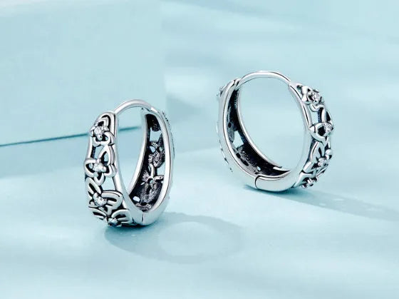 Sterling silver butterfly earrings with zircon stones and retro hollow design measuring 14mm by 5mm