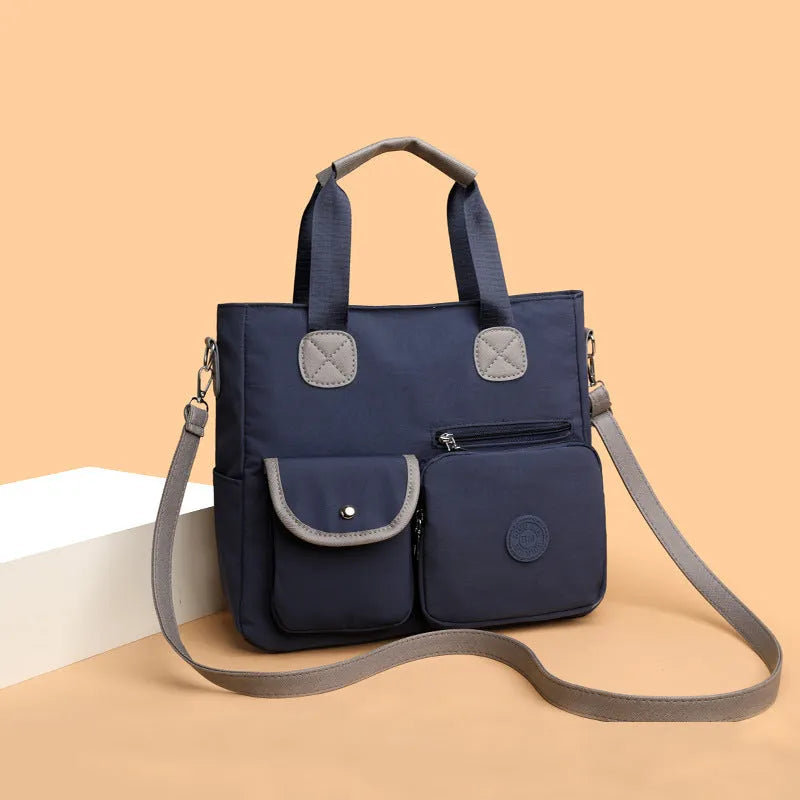 Women's nylon large-capacity crossbody bag in black with organised compartments and single shoulder strap