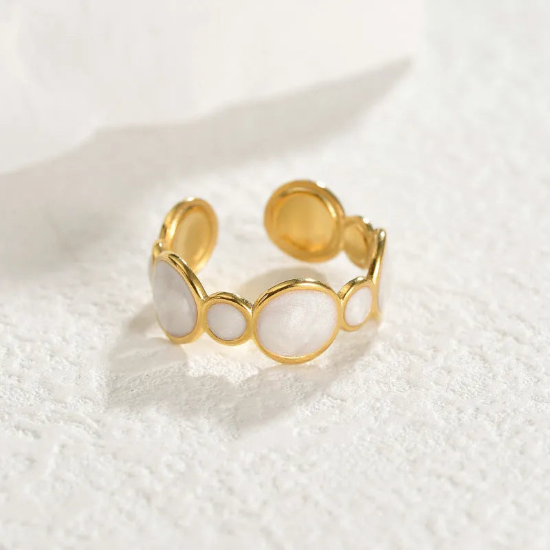 Geometric stainless steel ring with adjustable opening, electroplated metallic finish