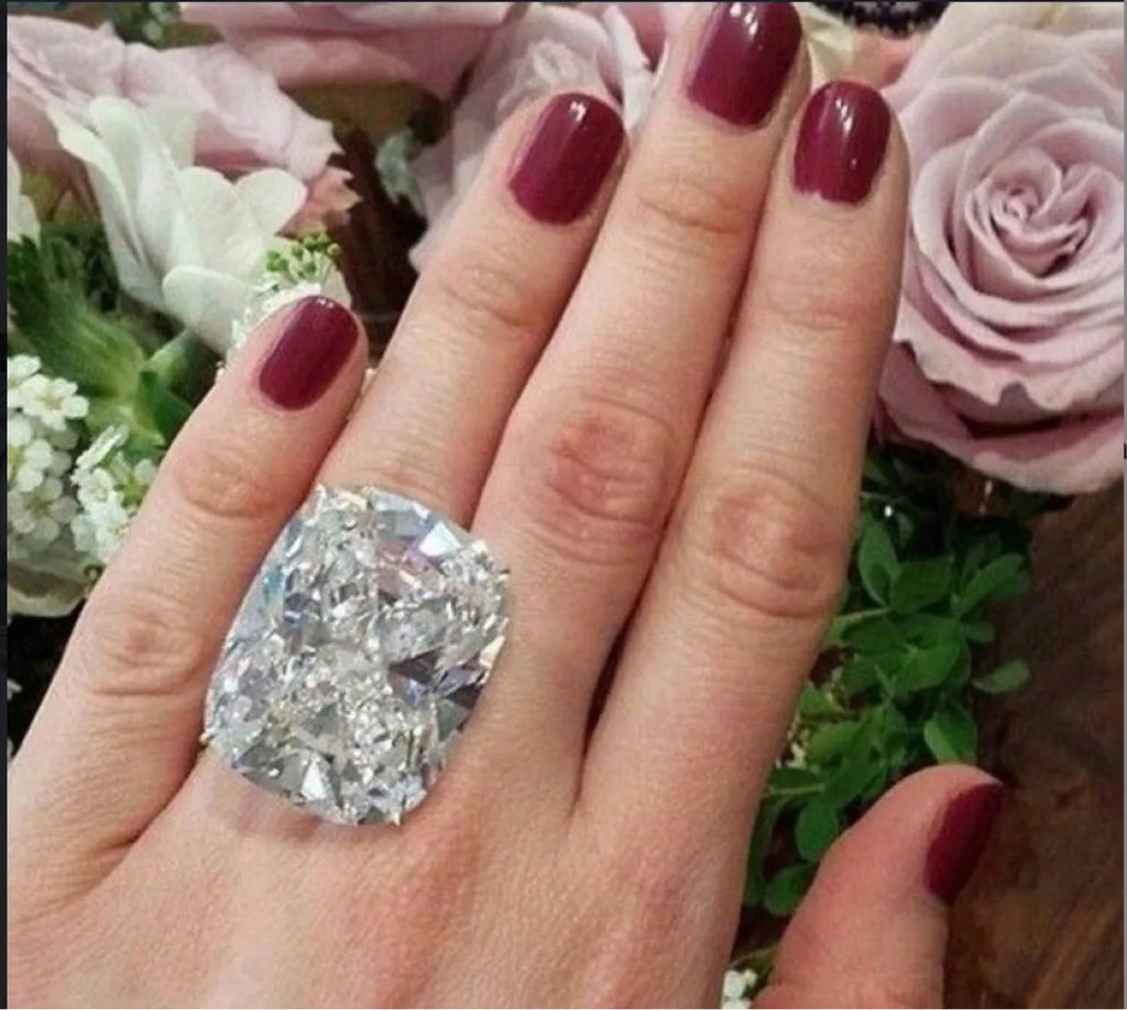 Simple geometric women's alloy ring with square detailing in white gold colour finish.