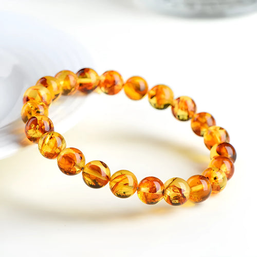 Natural yellow piebald amber bracelet with polished geometry beads for water purification