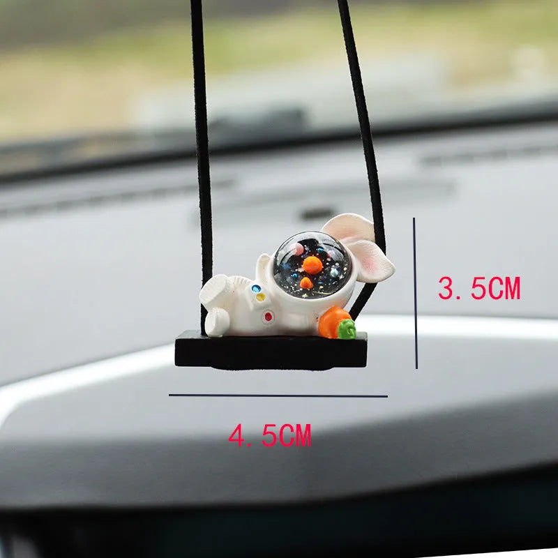 Cartoon astronaut resin pendant for car decoration, shown in various colour and style options.