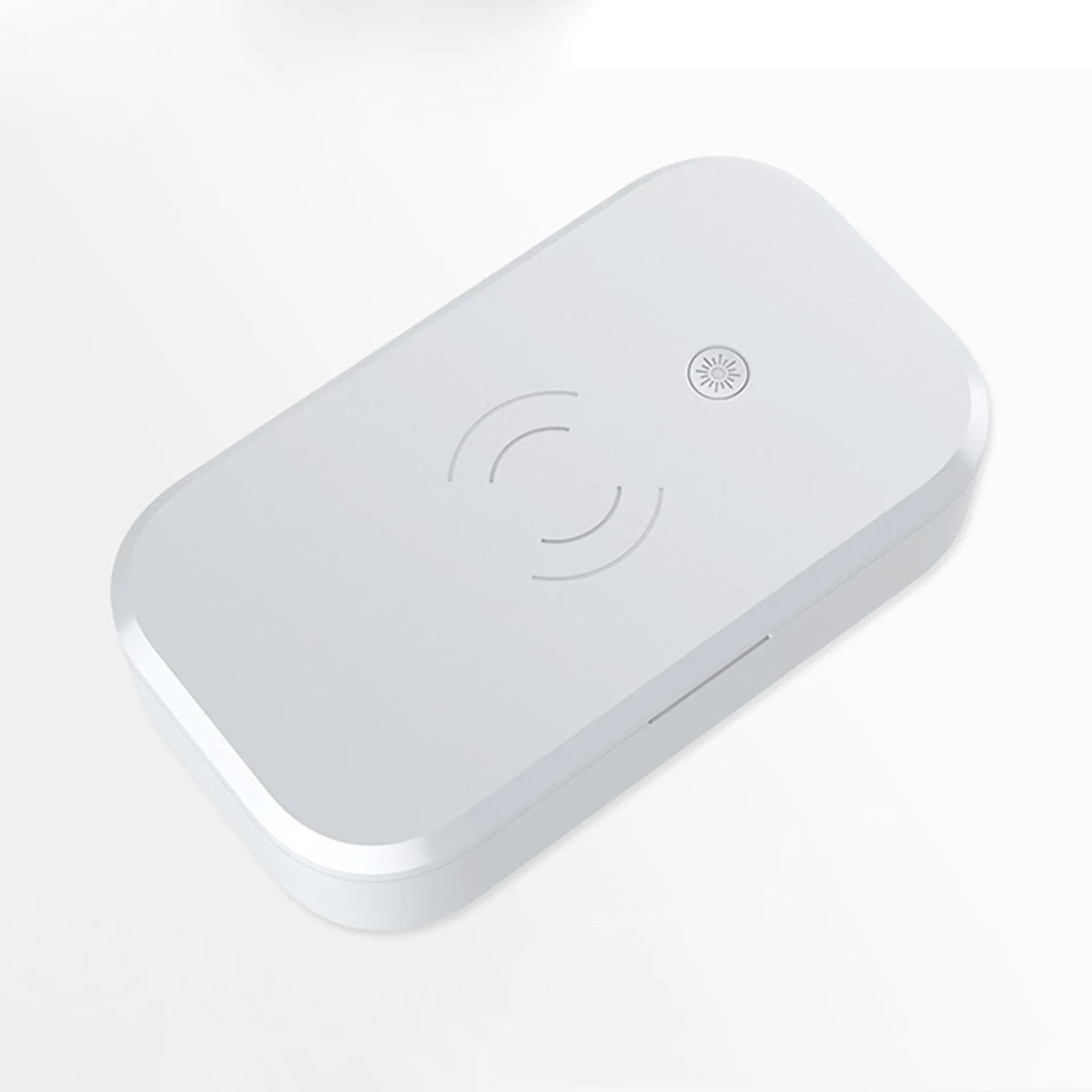 Compact white ultraviolet disinfection box with wireless phone charging pad on top.