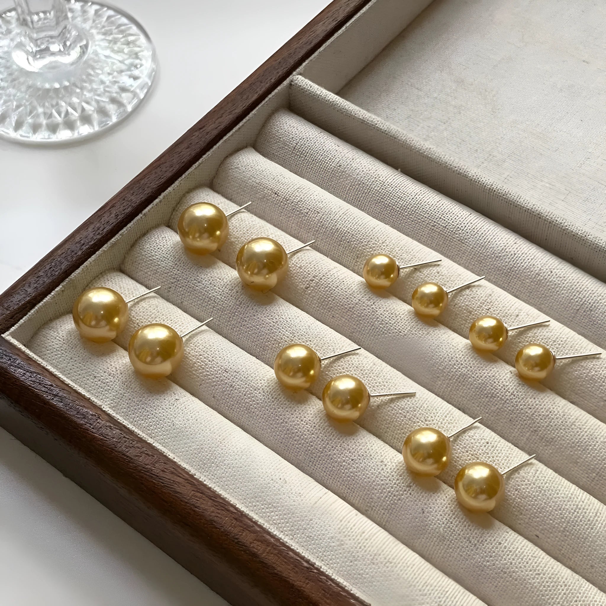 Large geometric pearl stud earrings for women with an eight-point star detail, shown in silver.