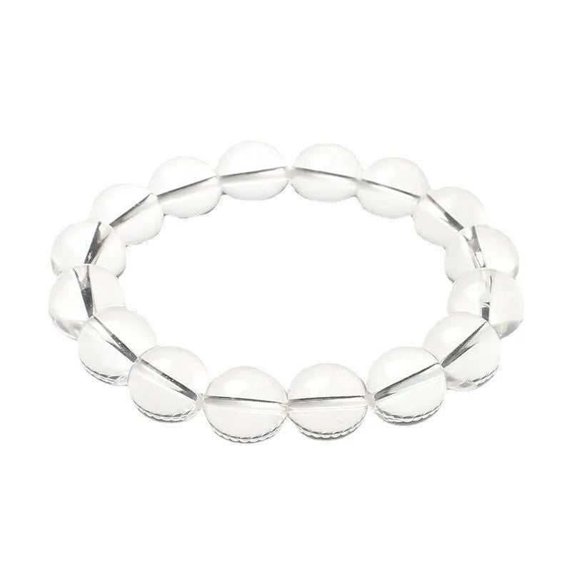 Natural Donghai old materials white water round crystal bracelet with geometric design on wrist.