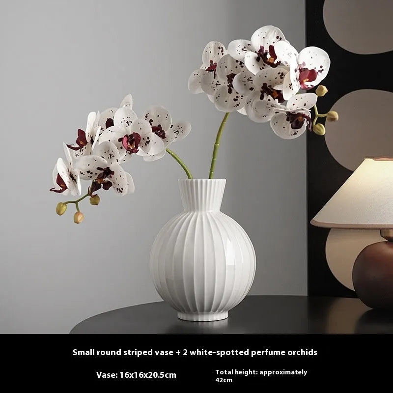 White American country style ball striped ceramic vase with orchid arrangement