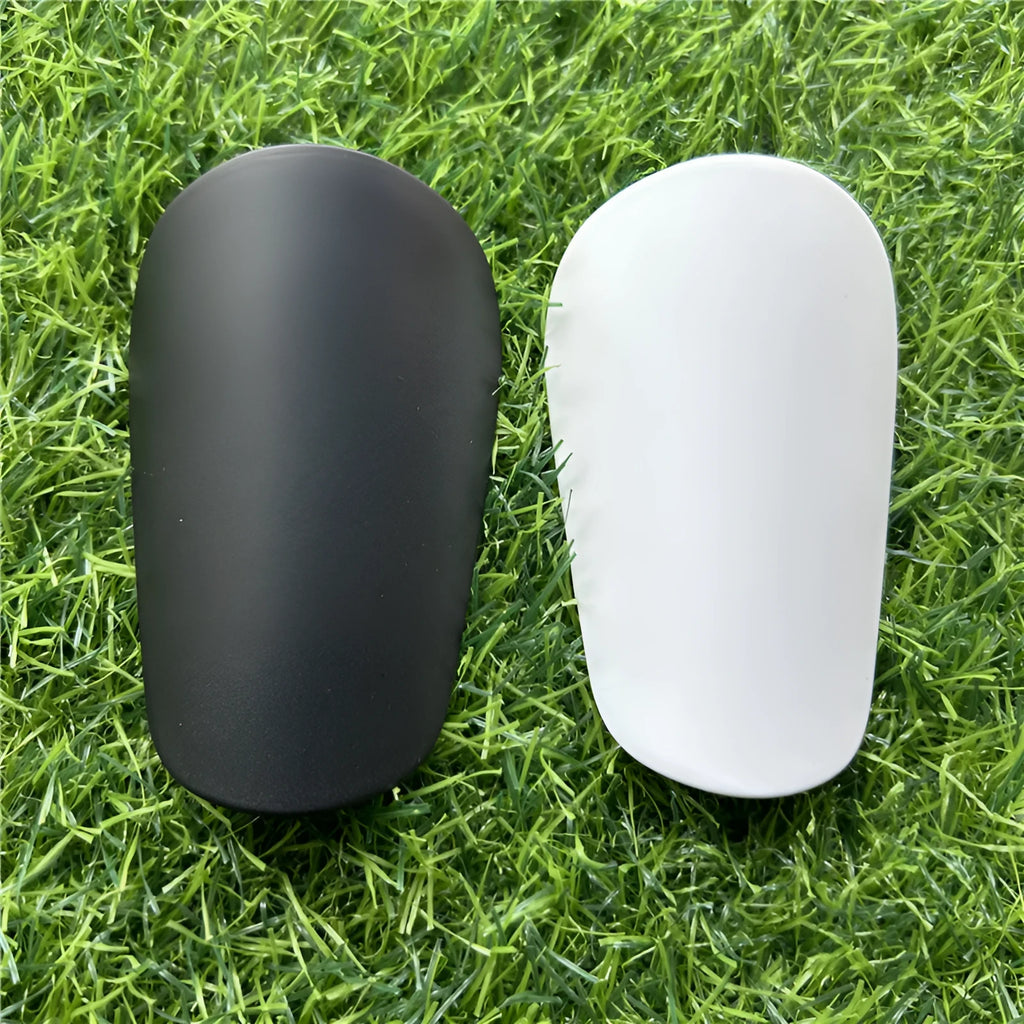Extra small plastic football shin guards in black or white colour options
