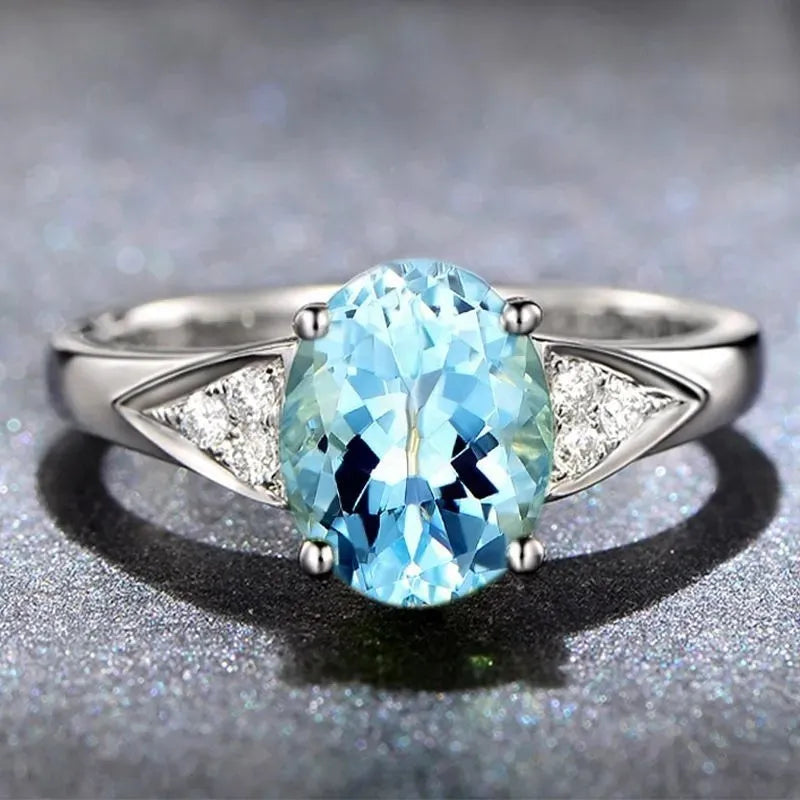 Ladies natural zircon ring with heart, water drop, or bell pattern in court setting, red or blue stone