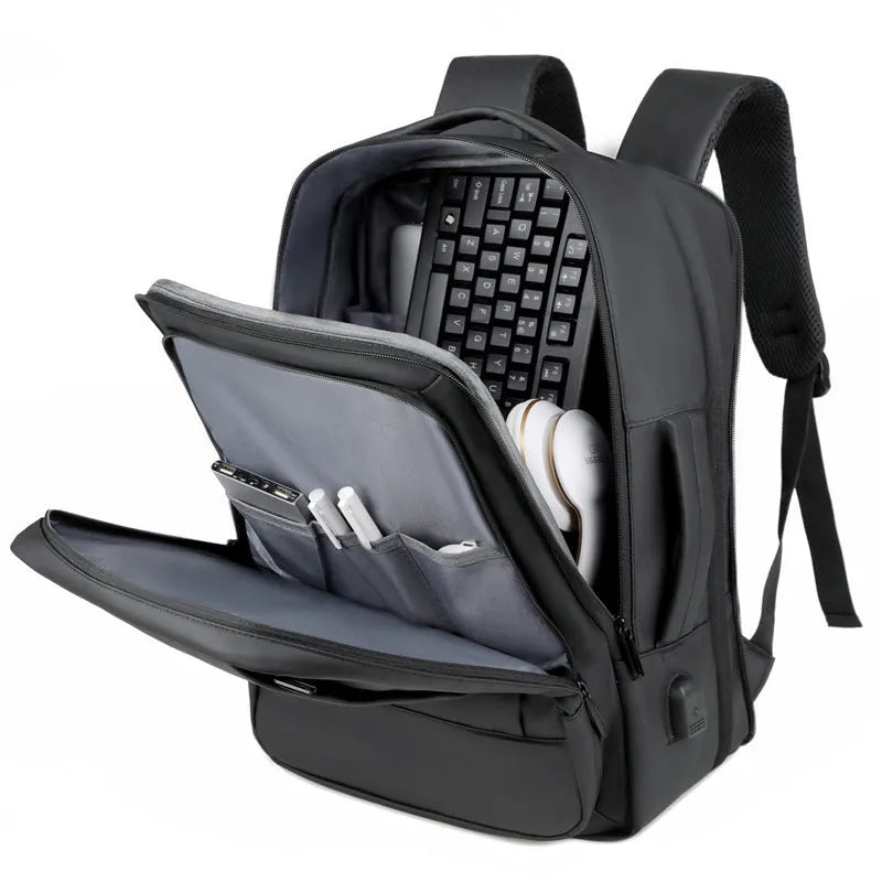 Black waterproof Oxford cloth business backpack with curved shoulder strap showing laptop compartment