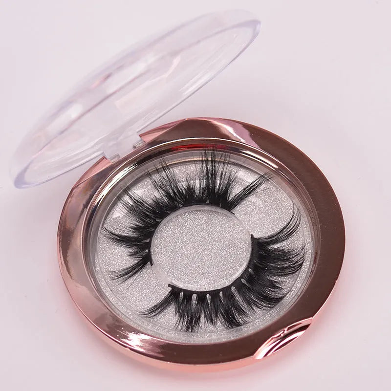 5D mink false eyelashes set with brush and hair cap on black background