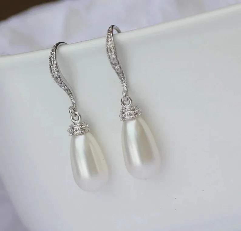 Silver alloy drop earrings with fully-inlaid artificial freshwater pearl and shell pearl surface