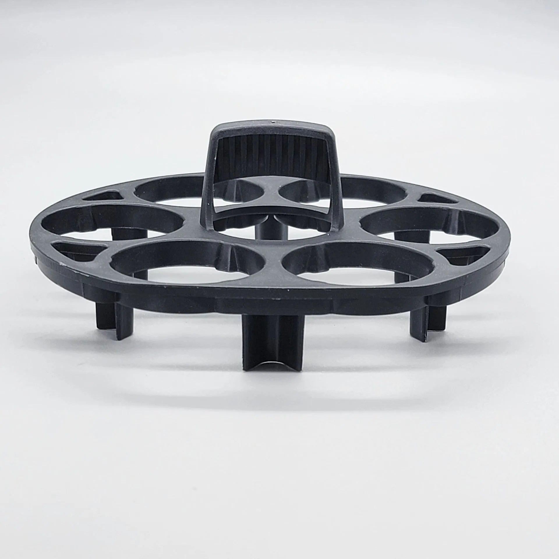 Black plastic egg cooking basket with modern design, shown with dimensions 13.8cm by 12.6cm by 5.7cm.