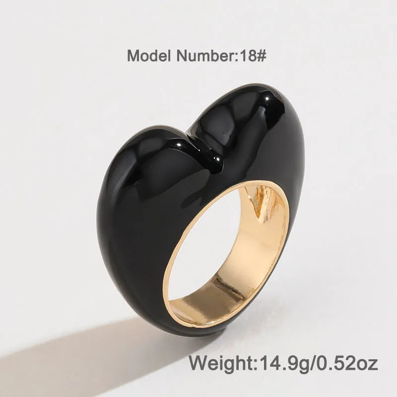 Colourful three-dimensional enamel heart ring on a zinc alloy band.