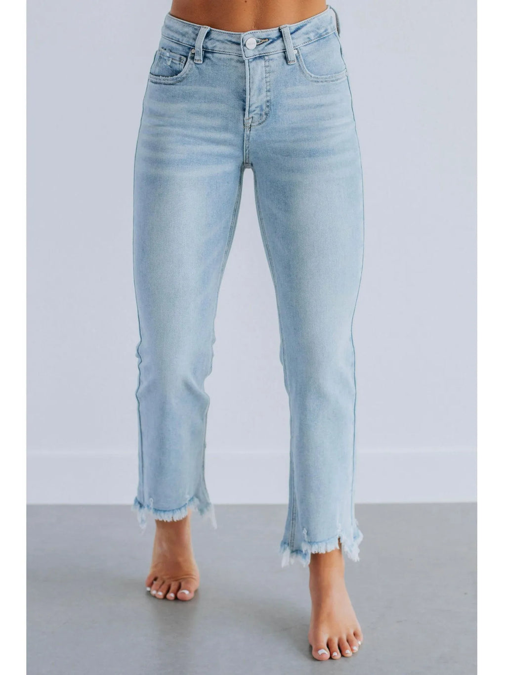 Women's solid blue denim trousers with a casual, hand-worn finish on a hanger.