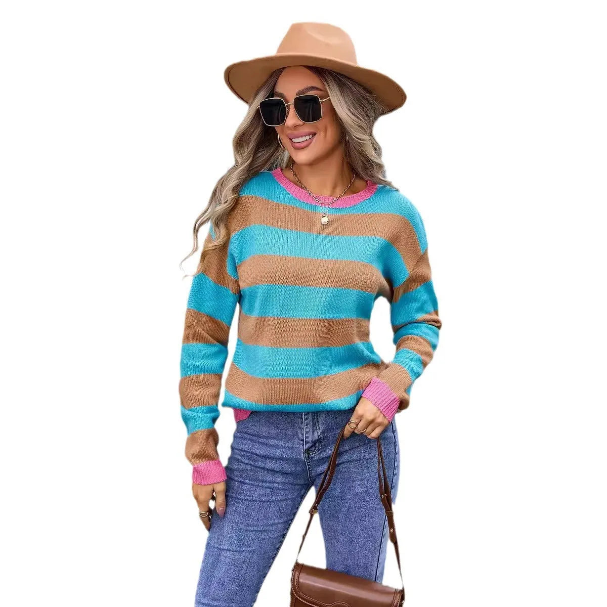 Women's loose fit acrylic sweater in blue with stripes, showing round neck and long sleeves.