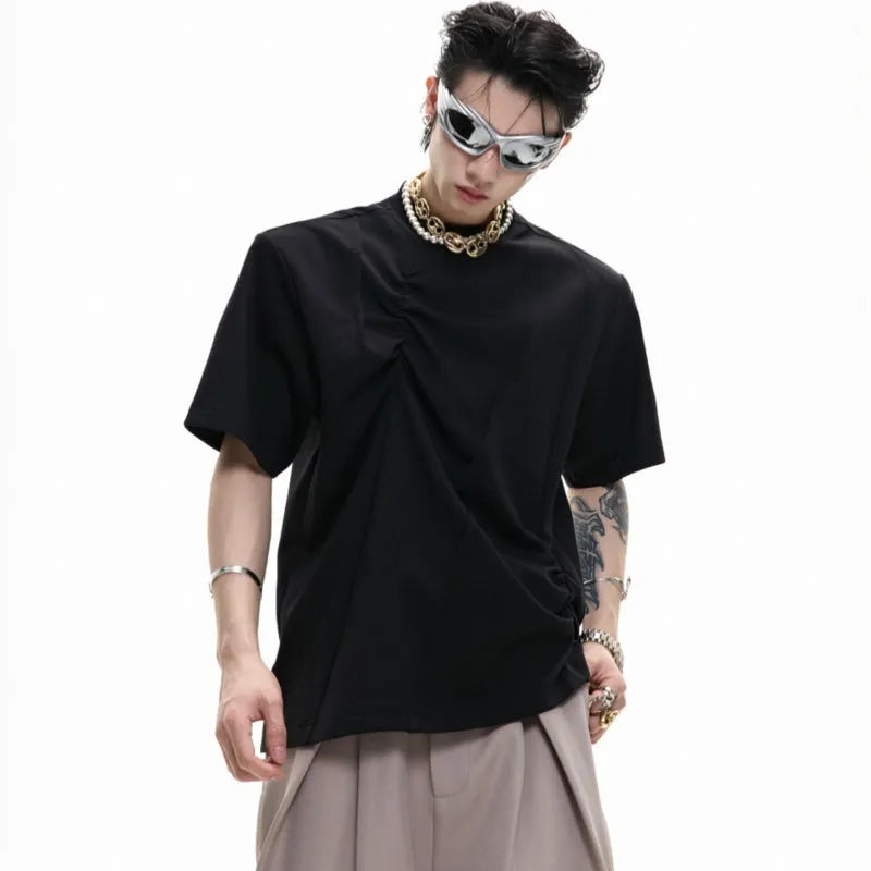 Men's loose grey cotton T-shirt with pleated detail and round neck.