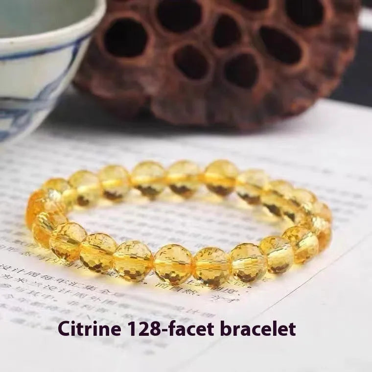 Close-up of a 128-facet cut crystal ametrine bracelet with detailed bead modelling on a wrist.