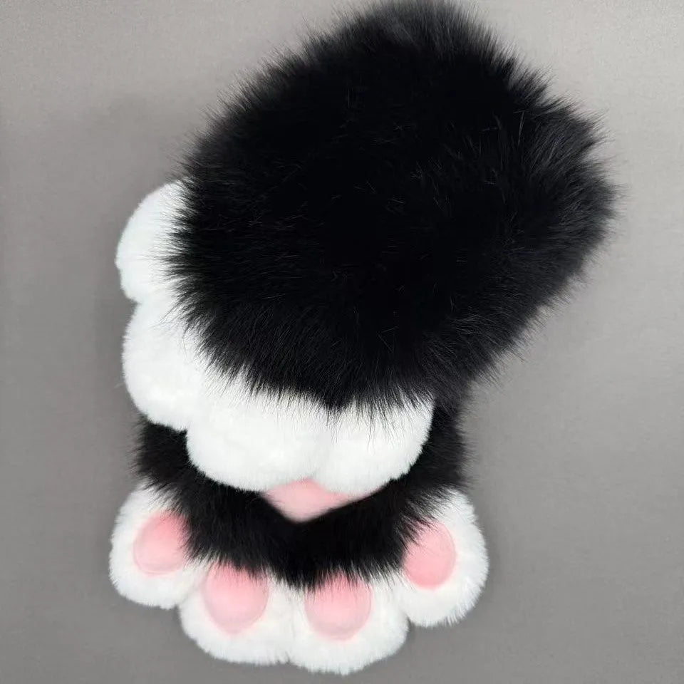A pair of fingerless animal claw cosplay gloves in a white and pink colour combination with a coloured pad on the back.