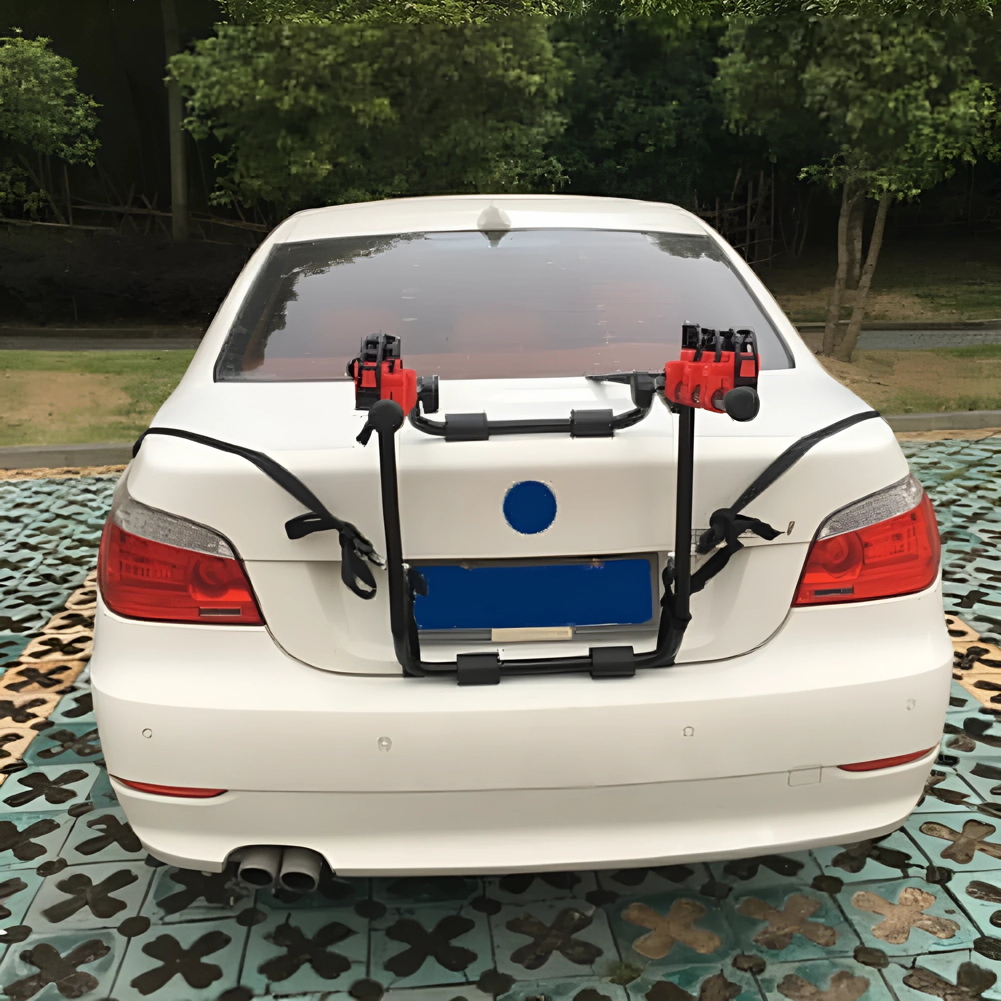 Black and red trunk-mounted car bike rack showing rope or pull belt attachment options.