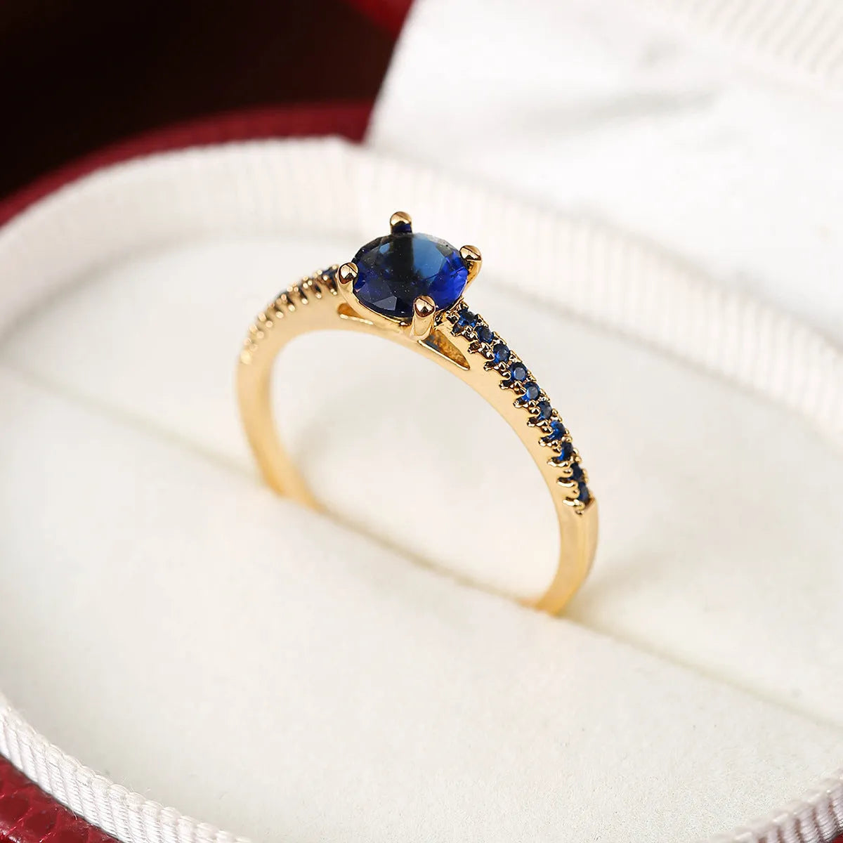 Hexagonal geometric zircon ring in copper with electroplated finish showing angular design and zircon stone