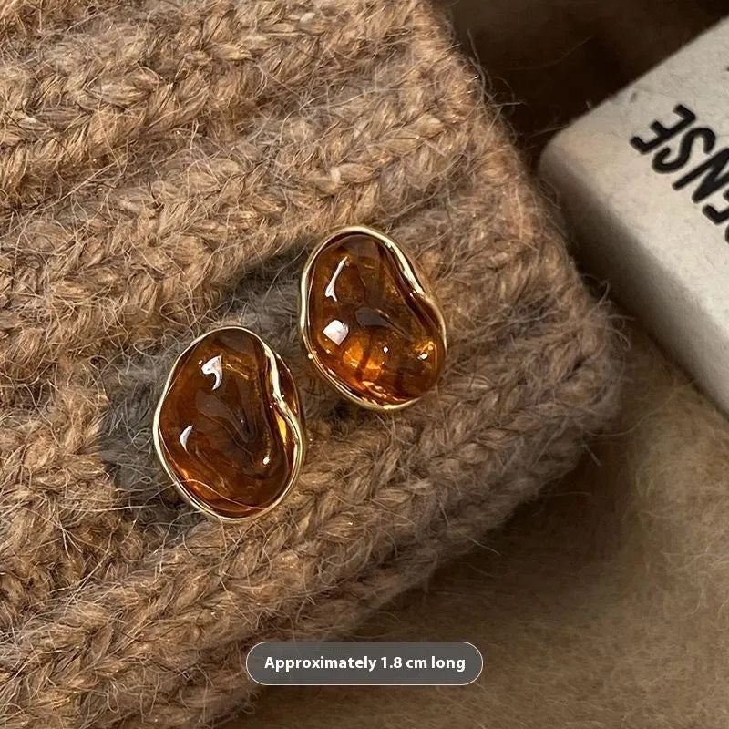 Handmade alloy earrings set showing three geometric designs: irregular amber, wafer disc and water drop tigereye styles