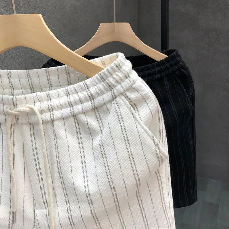 Men's black and white striped casual fleece-lined shorts with a double-layer waistband and straight leg.