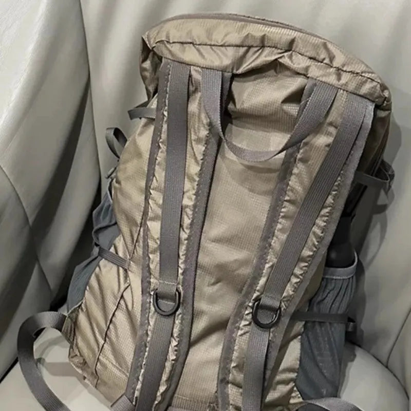 Natural revival khaki light solid colour nylon backpack with contrast details and curved shoulder straps