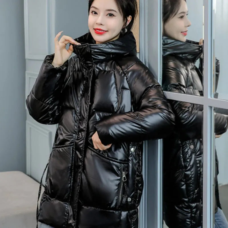 Women's loose fit hooded winter jacket in polyester blend available in four colours with Asian sizing.