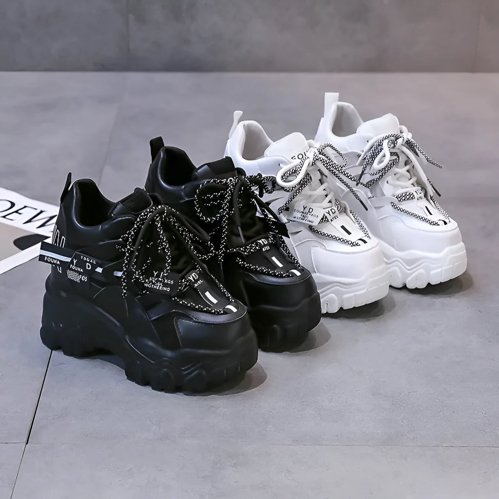 Women's white and black mesh platform sports shoes with cross-strap design and rubber sole