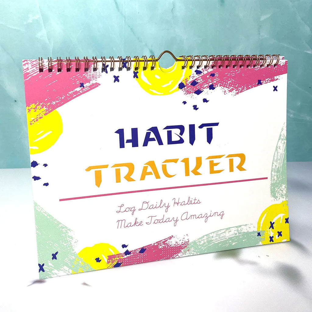 A4 habit tracking planner showing pink white cover with 12 internal pages for schedule recording
