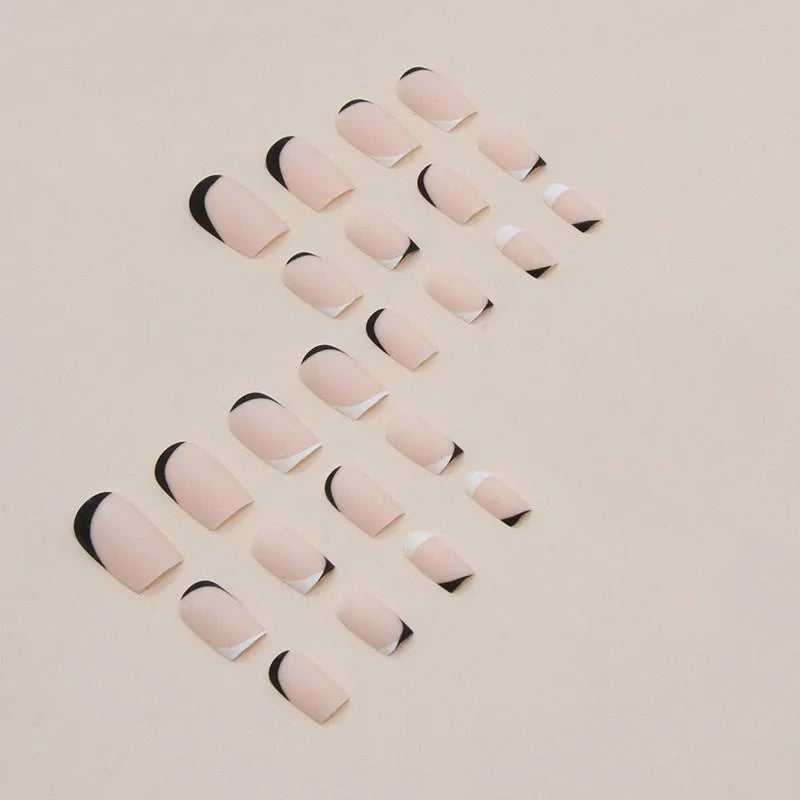 W644 black and white frosted false nail glue set with plastic pieces for a French manicure.