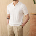 Short sleeve knitted polo shirt in a ramie-cotton blend with a seagull collar, shown in purple.