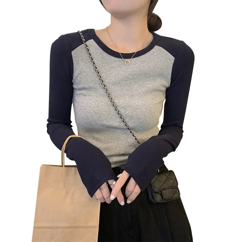 Women's dark blue viscose top with long polished princess sleeves and an oversized slim fit.