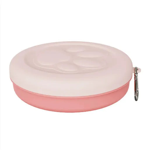 Portable plastic dog food bowl shown in light green colour suitable for outdoor feeding