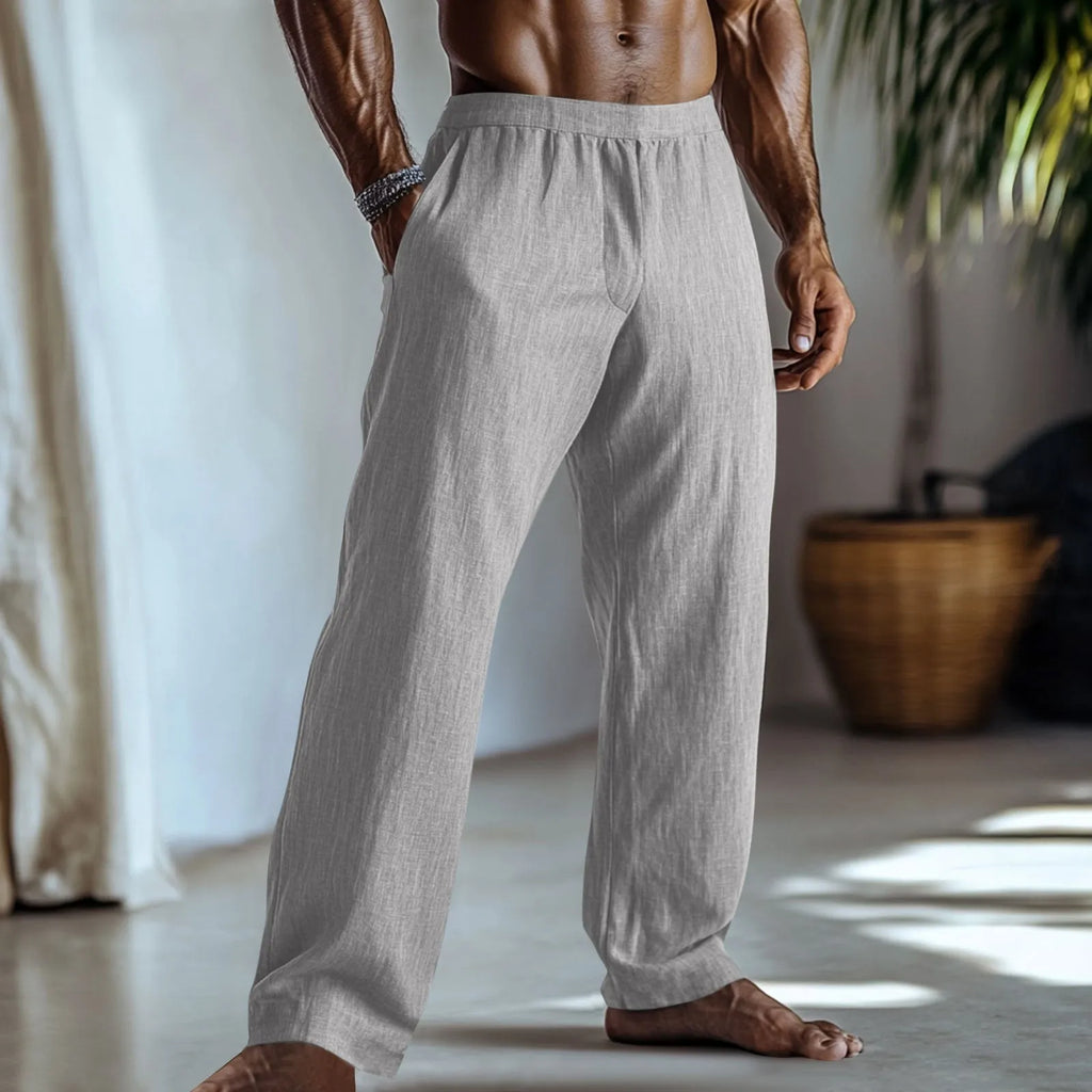 Straight-leg casual trousers in cotton and linen fabric on a hanger, showing light green colour and pocket detail