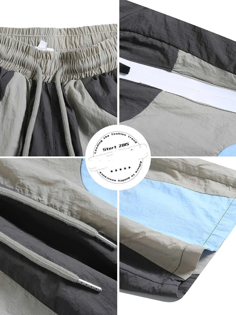 Blue patchwork men's sports shorts with elastic waistband and straight-leg design