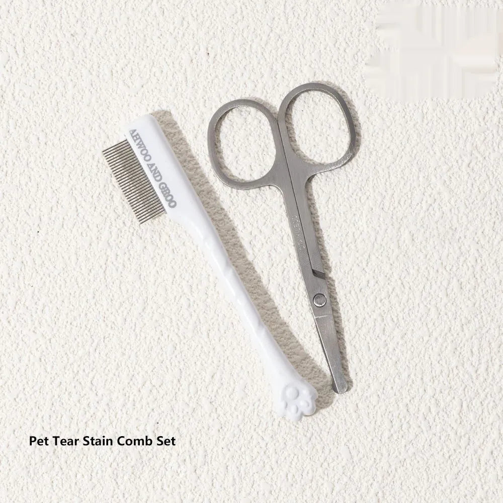 Black ABS plastic pet tear stain comb and scissors set on white background