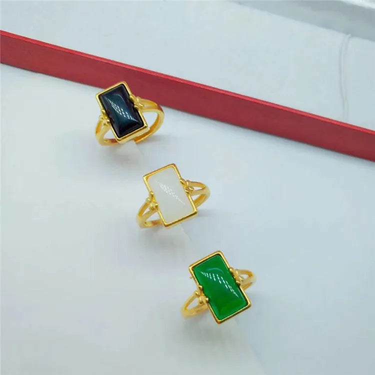 Brass gold-plated adjustable ring with long artificial gemstone in green, white, or black colour option