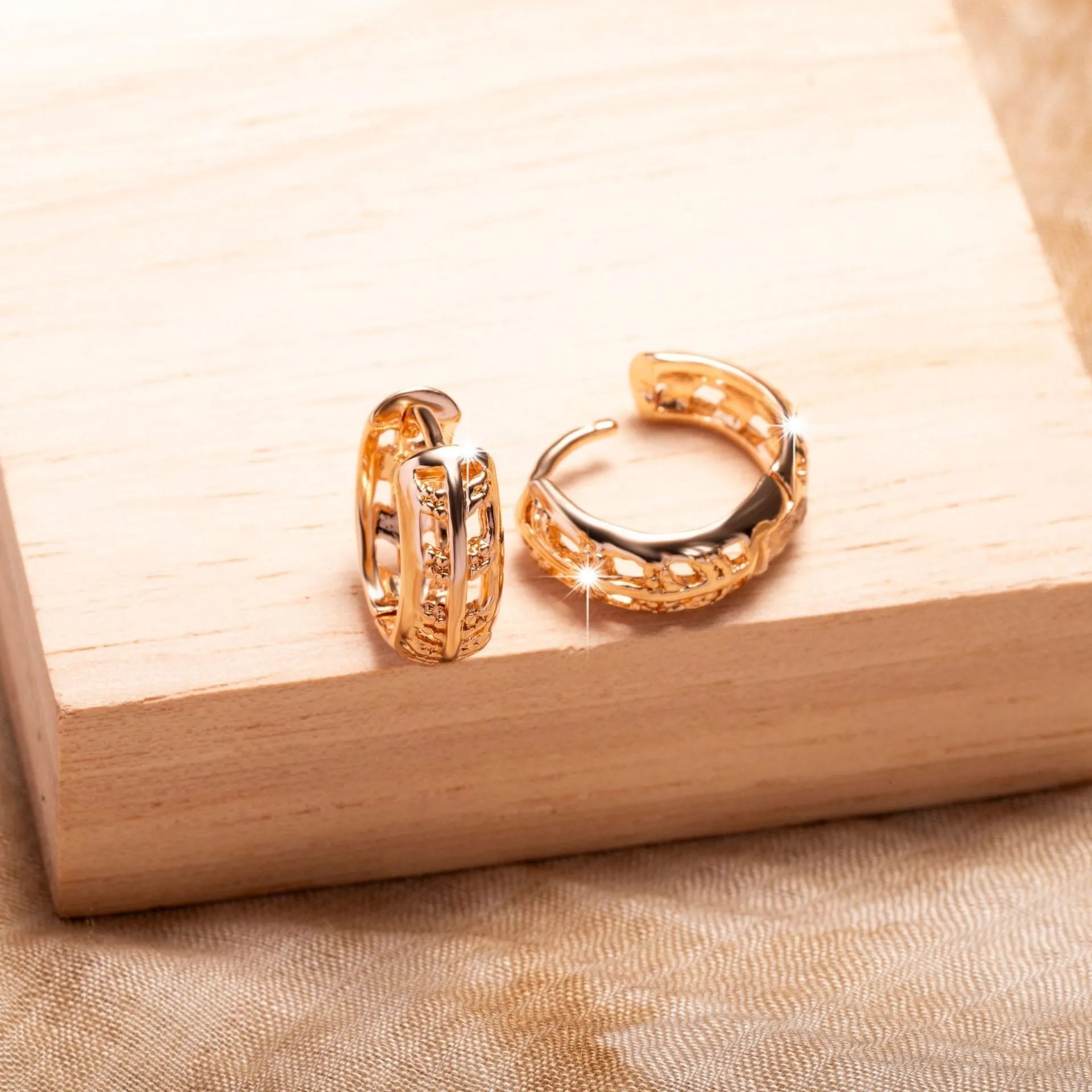 Rose gold plated hollowed-out copper earrings in a leaf shape design