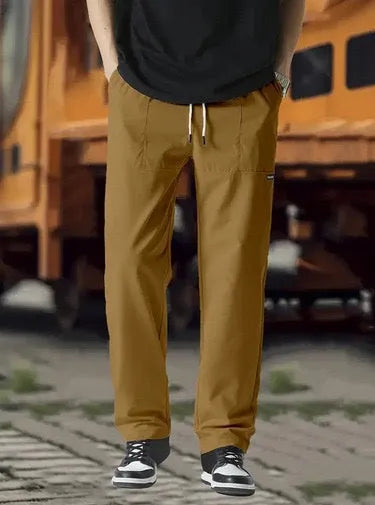 Men's polyester trousers for spring and autumn in light grey colour on a size chart