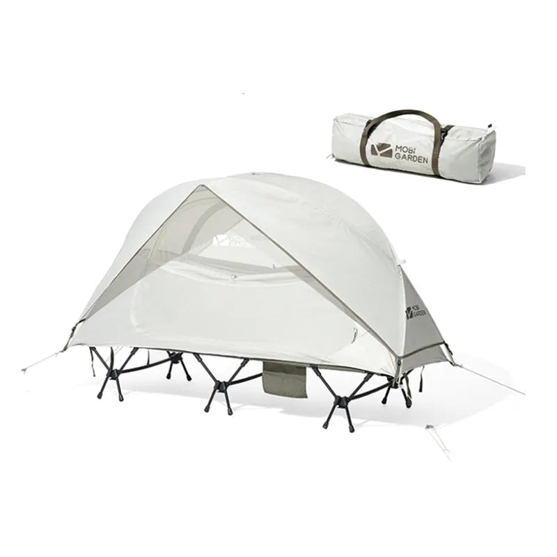 Ultra-light folding white single tent with aluminium poles on grass, 2.4kg