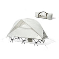 Ultra-light folding white single tent with aluminium poles on grass, 2.4kg