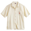 Light apricot men's Cuban collar shirt with bamboo plant pattern and short sleeves