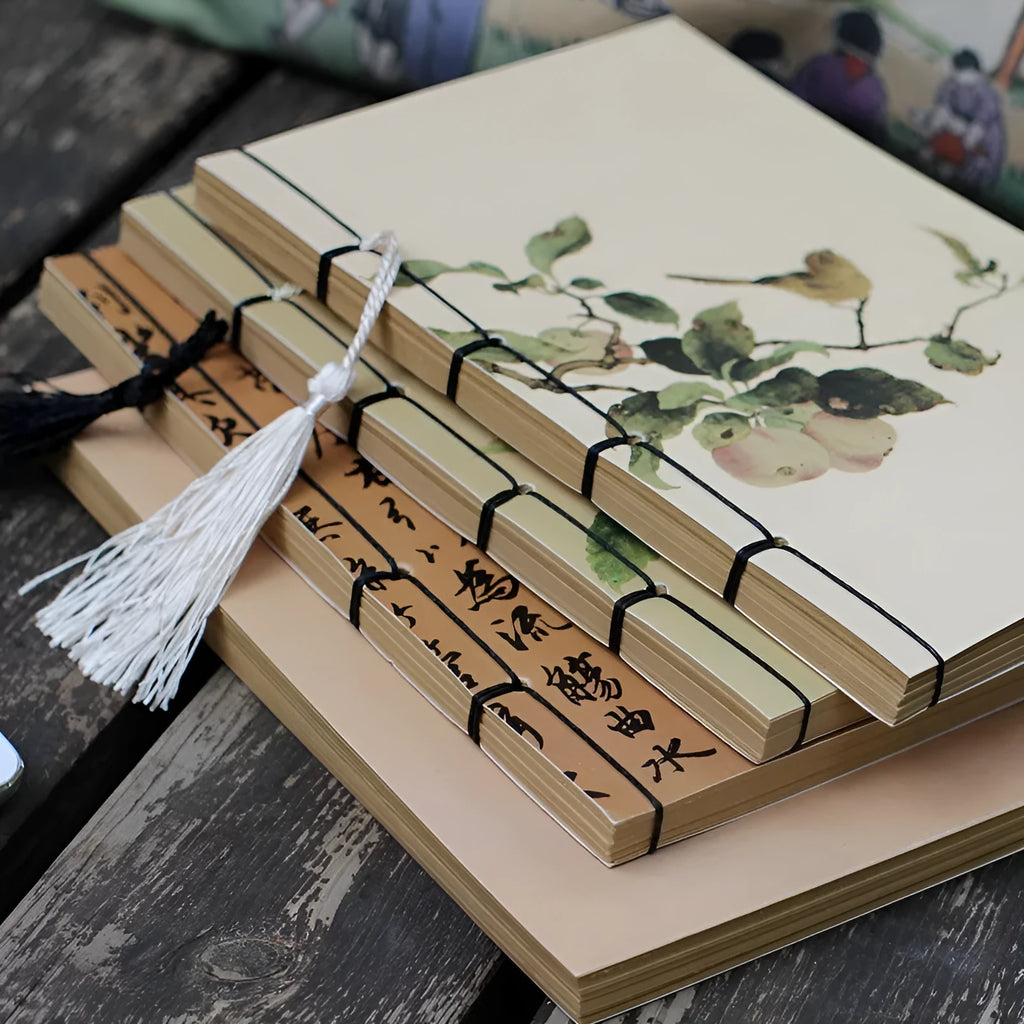 A5 antique art notebook with wire binding, decorative tassels, and traditional Chinese painting cover design