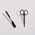 Black pet grooming brush with soft rubber bristles and stainless steel comb teeth for dogs and cats