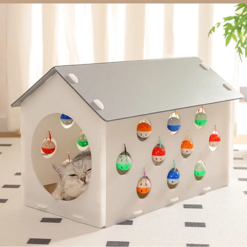 Integrated plastic cat scratch board with attached nest, tunnel, and a bell ball toy.