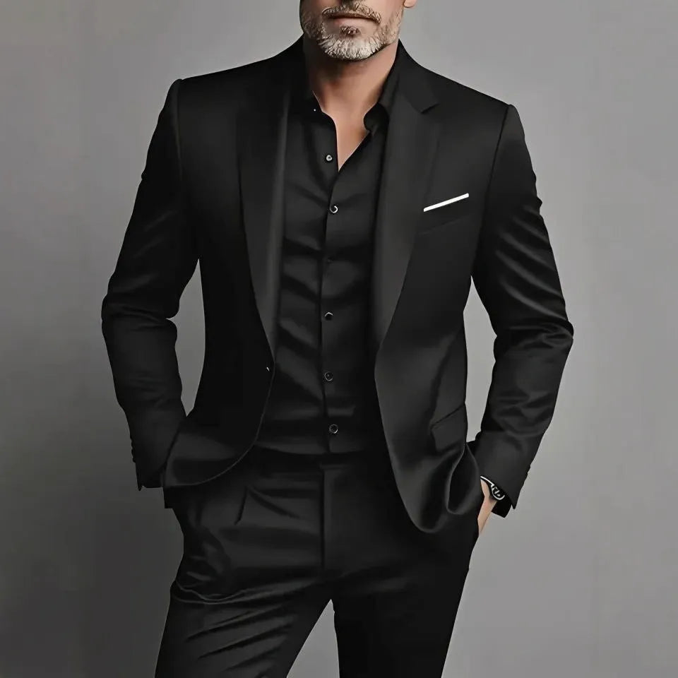 Men's slim fit casual two-piece suit set in black cotton blend fabric with coat and trousers on a hanger.